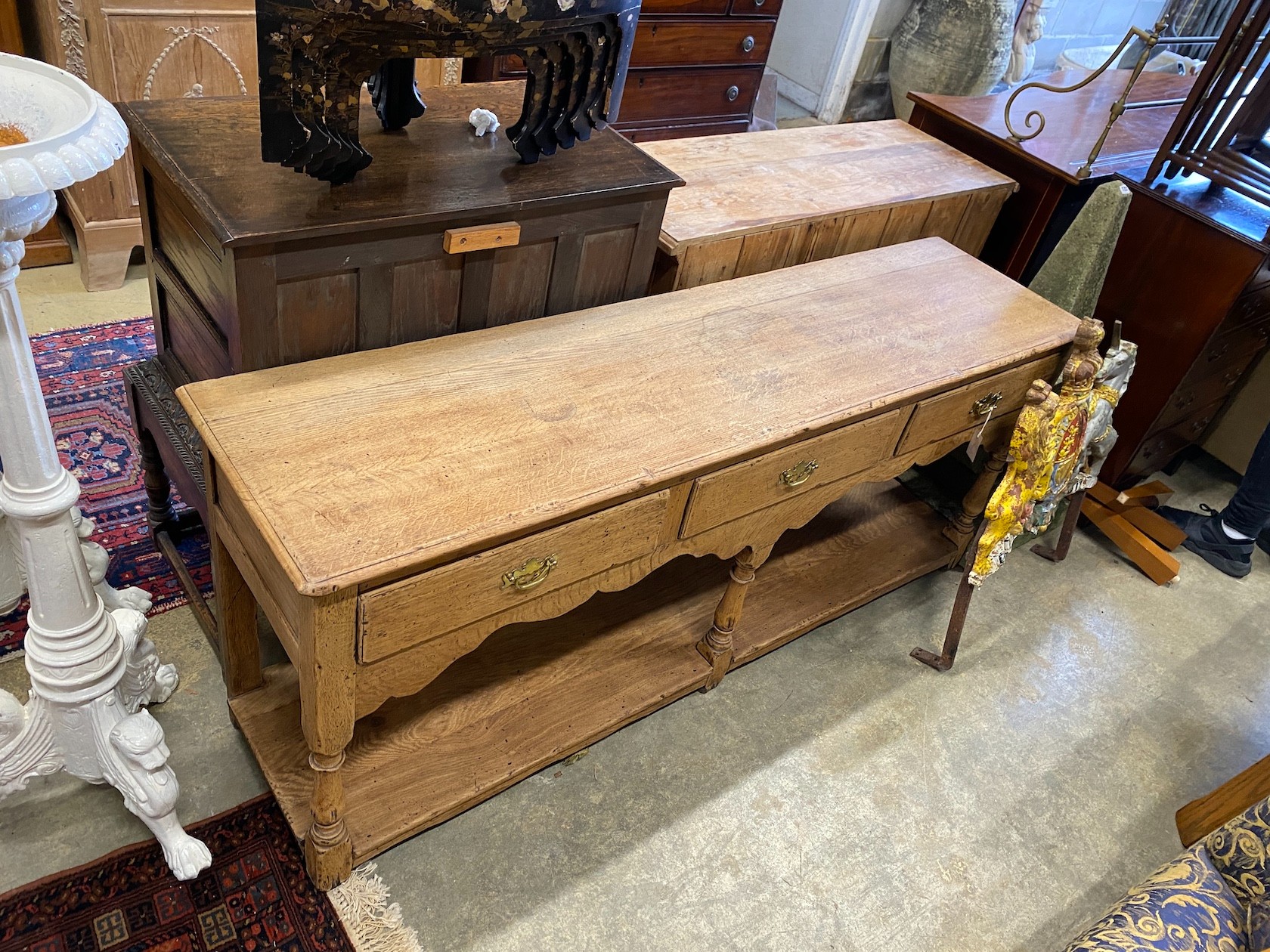 An 18th century style stripped oak potboard low dresser, length 183cm, depth 46cm, height 77cm